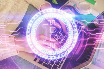 Obraz premium Double exposure of woman hands typing on computer and crypto market theme hologram drawing. Blockchain concept.