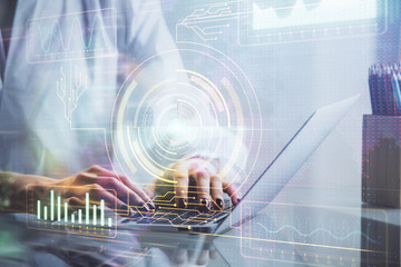 Double exposure of woman hands working on computer and data theme hologram drawing. Tech concept.