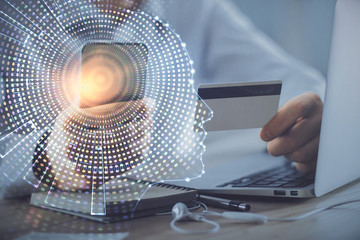 Double exposure of man hands typing on computer with credit card and brain theme drawing....