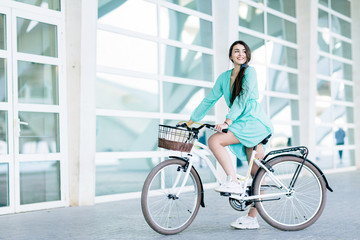 Fototapeta na wymiar Business woman riding her urban bicycle