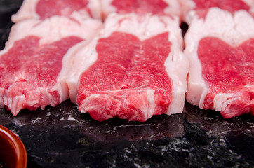 Raw meat on marble background
