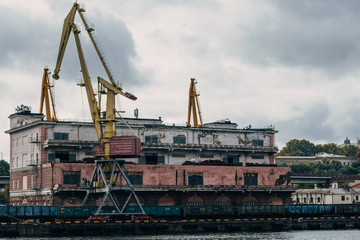 Fototapeta na wymiar huge loading and unloading cranes in the seaport in Odessa