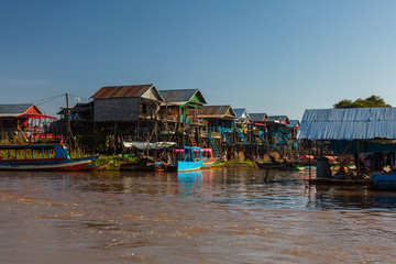 Kampong Phluk Floating Village on the Tonle Sap lake near Siem Reap, Cambodia during sunset. The...