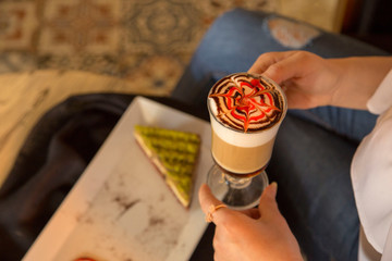 Woman drinking mocha at cafe 