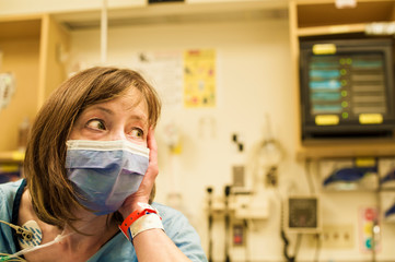 Fototapeta na wymiar Anonymous hospital patient is worried about virus pandemic 