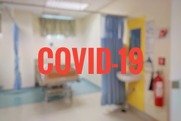 blurry image of hospital facilities with covid-19 wording 