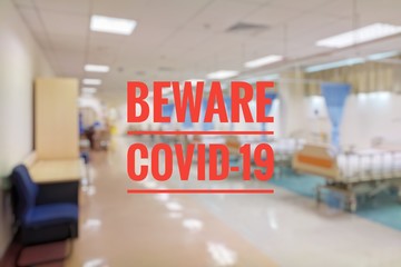 blurry image of hospital facilities with covid-19 wording 