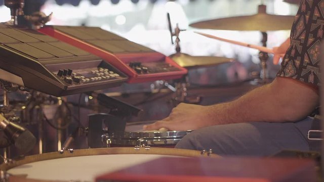 Drummer playing on stage at a summer festival