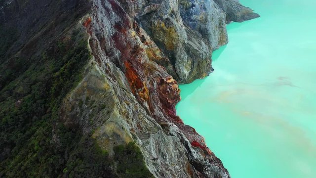 Aerial view of mountain Kawah Ijen volcano with blue acid lake. East Java, Indonesia