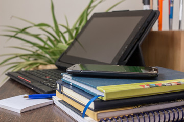 laptop on a table in a corner as a homeoffice  - notepad cell