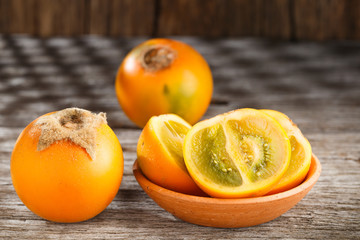 Fruit of lulo or naranjilla on wood