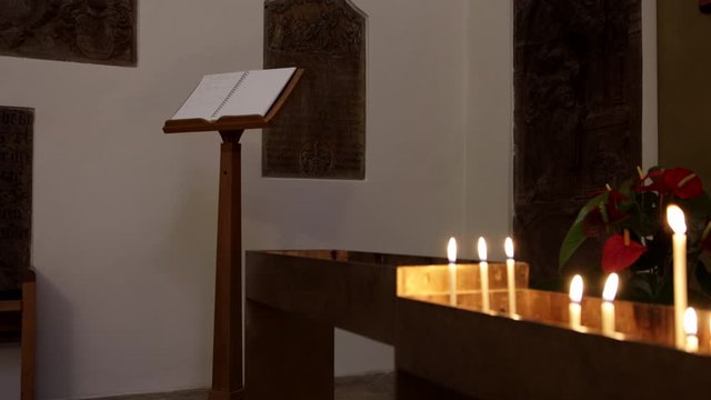 german city freising candles burning near holy bible