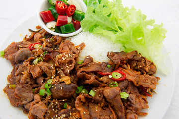 Stir fried with pork and vegetables sprinkle sesame seeds