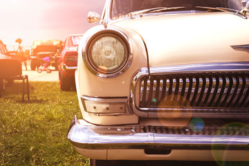 Vintage retro white car in the morning sun.