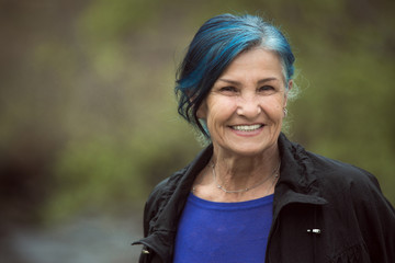 senior woman with blue hair - Powered by Adobe