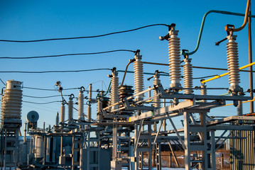High voltage transformer substation in winter. High voltage power lines. Power transmission...