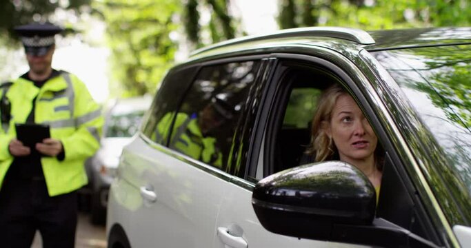 4K Guilty woman driver trying to talk her way out of a ticket from traffic cop. Slow motion.