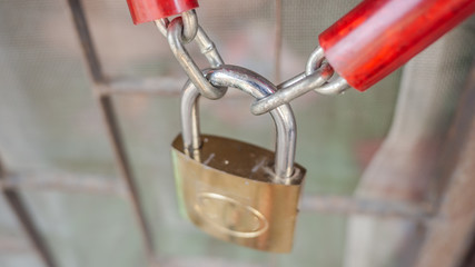 Closeup steel door with lock , vintage lock and chain on a door. Security of your life.