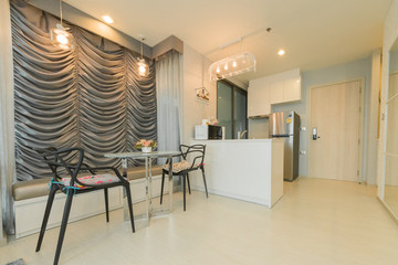 Stylish kitchen interior with dining table and chairs