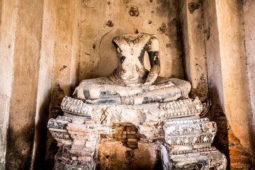 The broken Buddha Image in Ayutthaya historical park, Thailand.