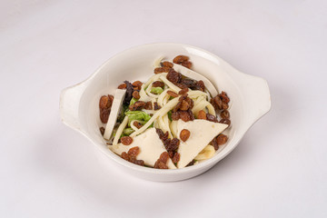 cheese and raisins on a plate