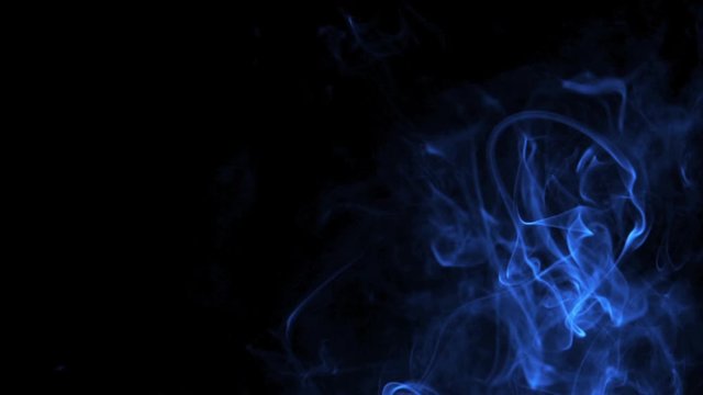 Bright blue smoke rising and falling in black background - graphics