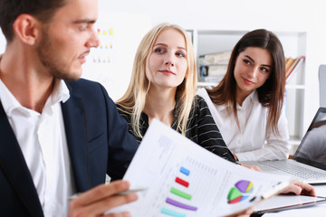Group of people hold silver pen ready to make note in clipboard pad sheet closeup. Training course...