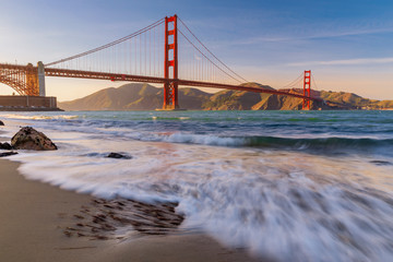 Sunset at the beach by the Golden Gate Bridge in San Francisco California