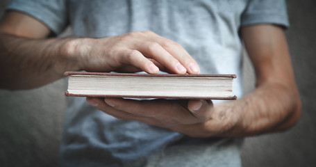 Caucasian man holding bible. Religion