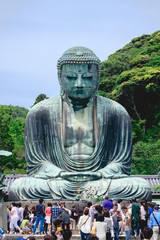 Great Buddha (Daibutsu) bronze statue of Amida Buddha and visitors and tourists at Kōtoku-in...