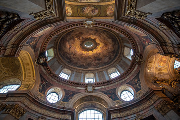 Fototapeta na wymiar Vienna, Austria - Interior view of famous cupola of baroque Roman Catholic parish St. Peter's Church (Peterskirche) on Petersplatz. Details of the dome's frescoes.
