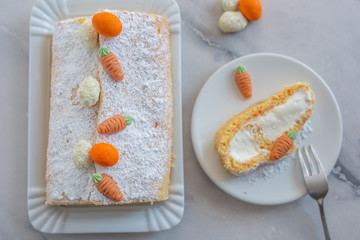 home made Easter sponge roll with carrots on a table