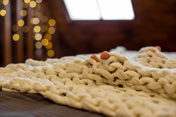 Obraz premium horizontal close-up photo of children's toes on the background of a knitted plaid