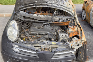 city burned cars after a fire in one of the city's districts