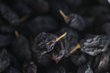 dry raisins on a white table