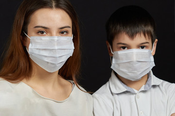 portrait of people in a medical mask a Girl with a medical mask a boy in a mask, to protect against the spread of the virus