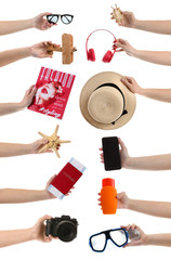 Many hands with travel items on white background
