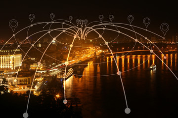 View of modern city with location pointers at night