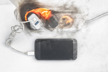 power supply burns with fire, phone on recharge, the fire in the apartment. cause of the fire...