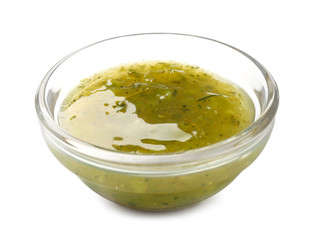 Bowl with tasty sauce on white background