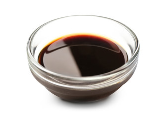 Bowl with tasty sauce on white background