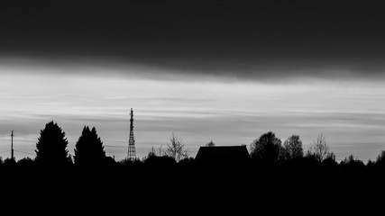Black and white photo of the silhouette of the night city.