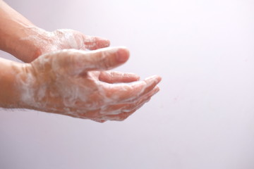 washing hands with liquid soap and sponge