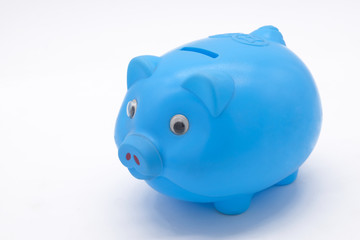Blue piggy bank or money box isolated on a white background