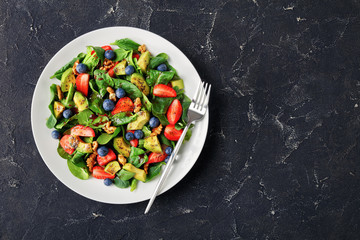 spinach avocado walnuts berries salad, flat lay