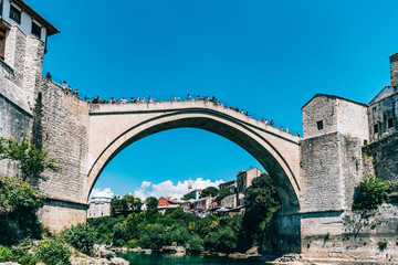 Fototapeta na wymiar People on Mostar bridge, Bosnia & Herzegovina