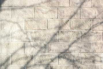 Light gray-beige textured tiles, illuminated by the sun, background image, textures