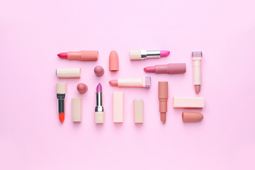 Naklejka premium Different lipsticks on color background