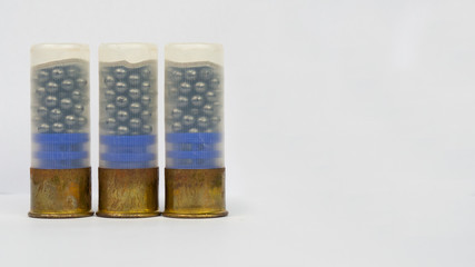 12 gauge shotgun ammunition on a white background