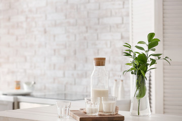 Glassware of fresh milk on table